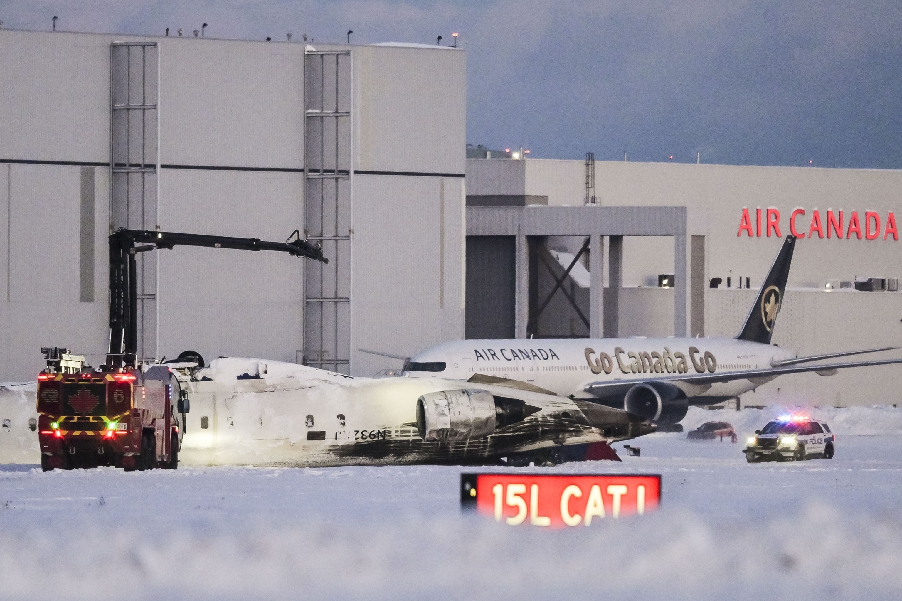 PHOTO: Emergency crews gather at the accident site where a Delta Air Lines flight flipped upside down while landing at Toronto Pearson International Airport in Mississauga, Canada, Feb. 17, 2025.