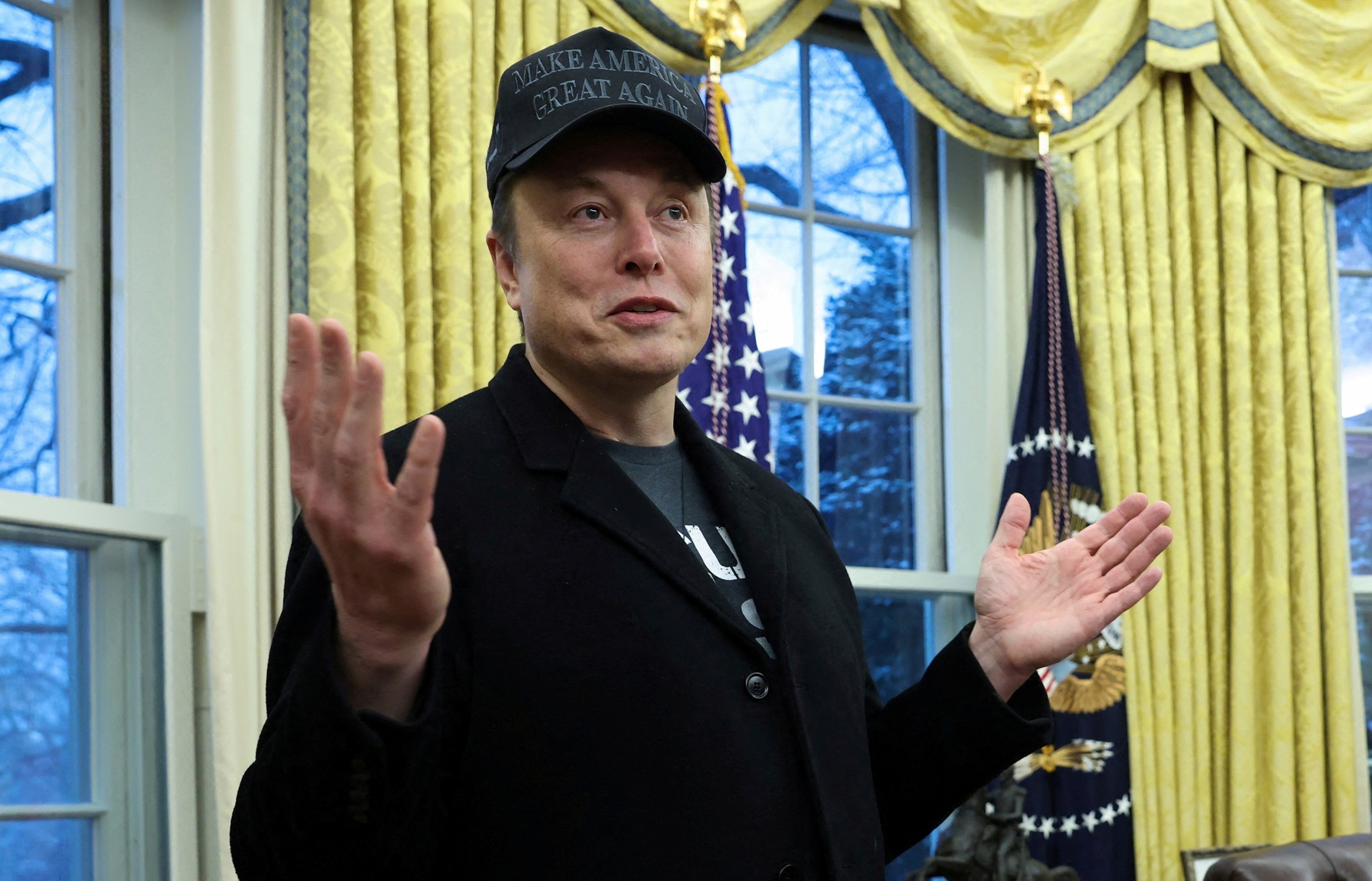 PHOTO: Elon Musk speaks in the Oval Office of the White House in Washington, Feb. 11, 2025.
