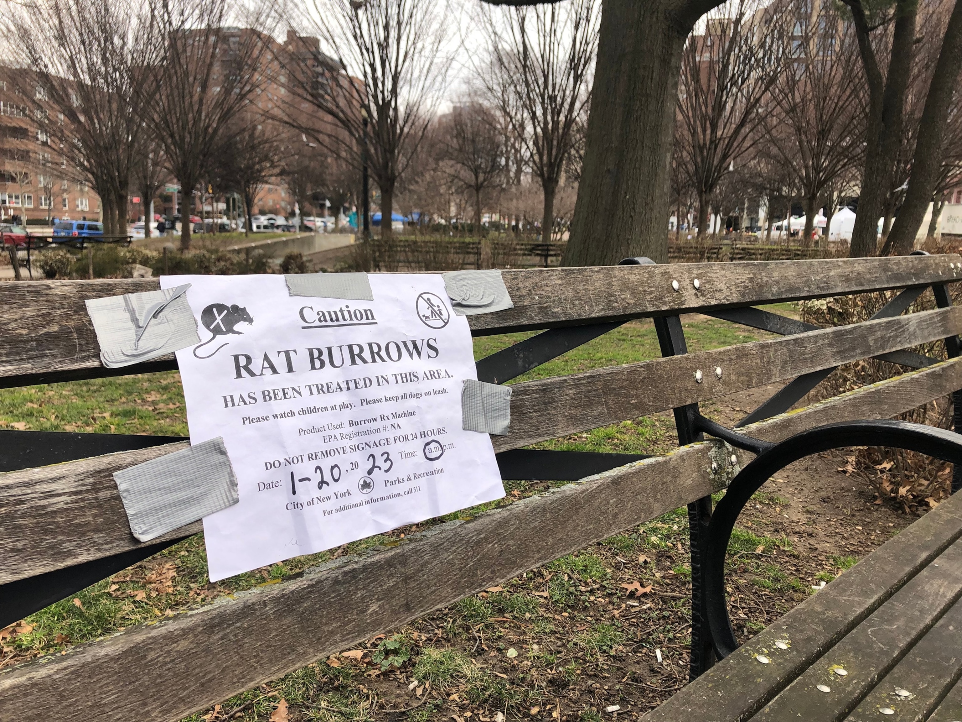 PHOTO: Caution Rat Burrows sign on park bench, pest control, Queens, New York